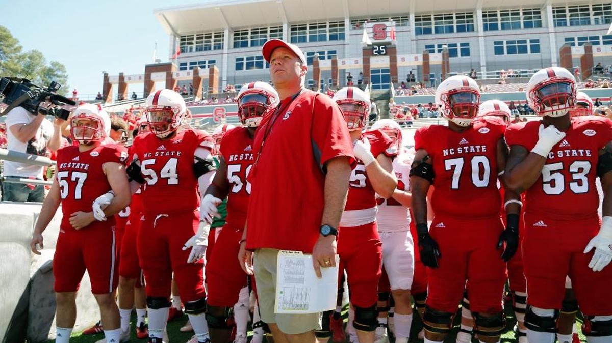 Wolfpack head coach Dave Doeren and his players prepare to take the field for the spring football game in April.