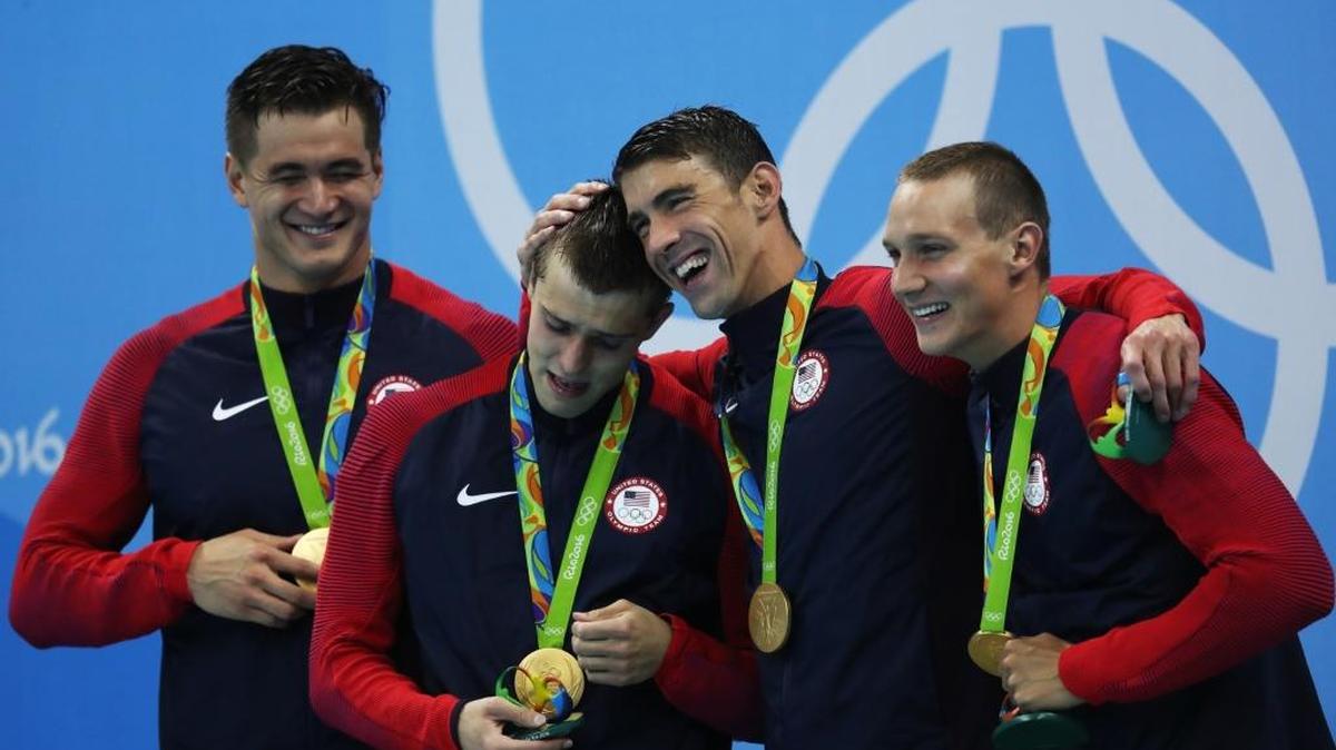 Gold medalists Nathan Adrian, Ryan Held, Michael Phelps and Caeleb Dressel of the U.S. pose on the podium after winning gold in the 4x100 meter freestyle relay on Aug. 7, 2016 at the Rio Olympics.