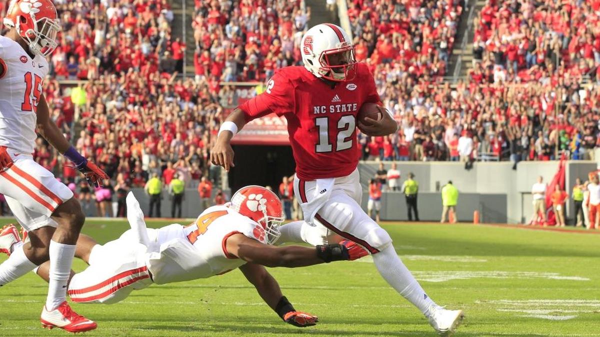 N.C. State quarterback Jacoby Brissett, right, beats Clemson's B.J. Goodson to score on a 13-yard touchdown run in 2015.