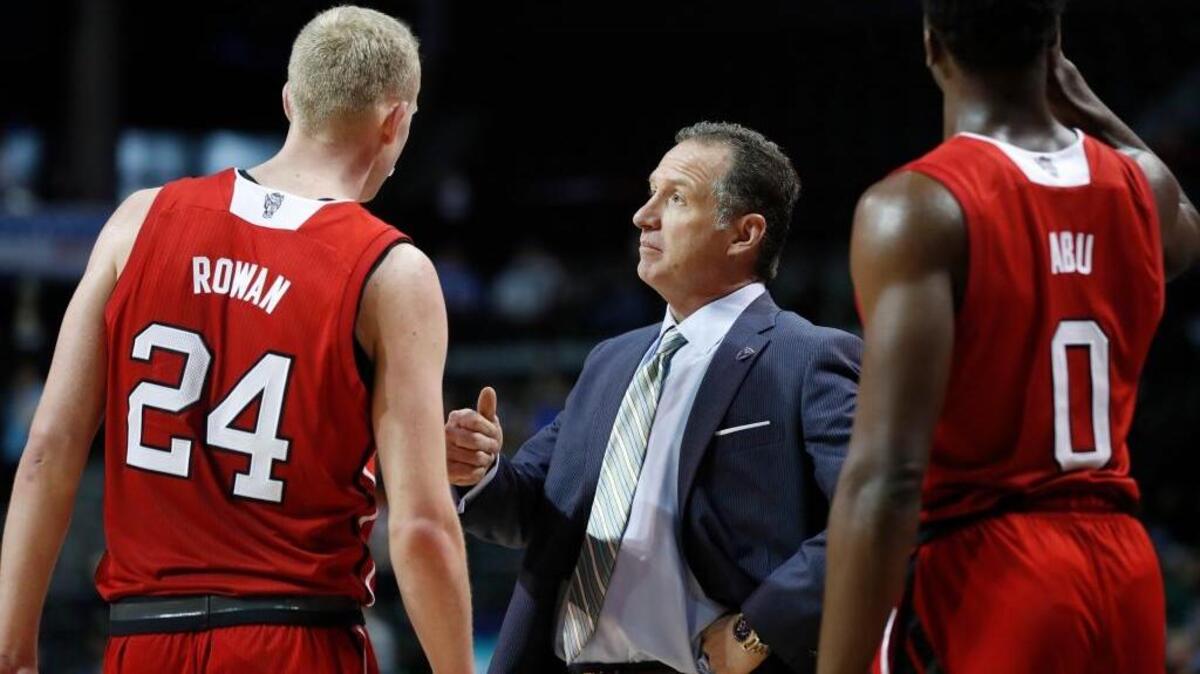 N.C. State's head coach Mark Gottfried talks with Maverick Rowan (24) during the second half of Clemson's 75-61 victory over N.C. State at the ACC tournament at the Barclays Center in Brooklyn, N.Y., on March 7, 2017. N.C. State's Abdul-Malik Abu (0) stands to the right.