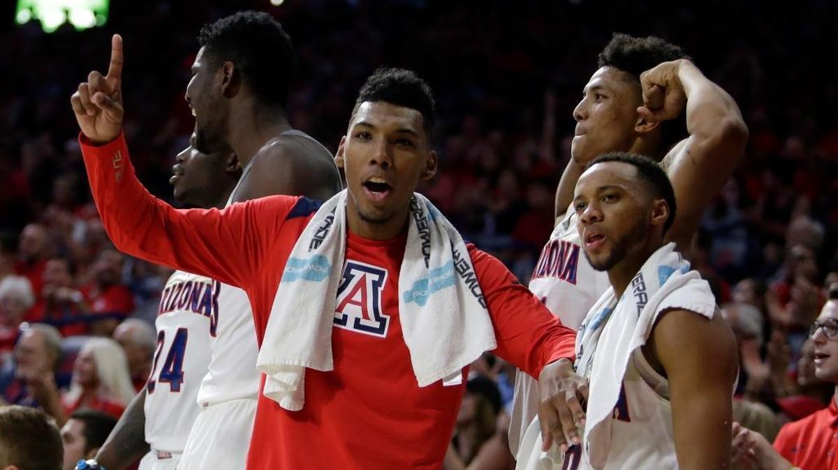 Guard Allonzo Trier, middle, and his Arizona teammates cheer from the sidelines against Northern Arizona on Nov. 10. Arizona faces NC State on Wednesday in the Bahamas.