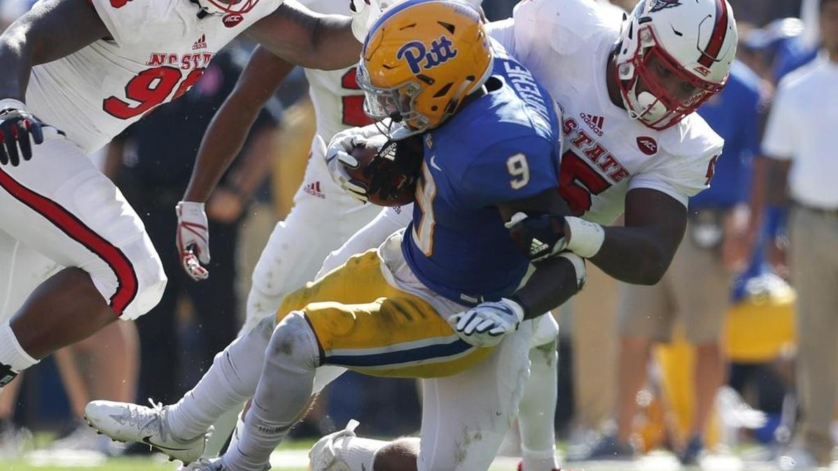 N.C. State's Darian Roseboro (45) tackles Pitt's Michael Smith (9) during the second half of N.C. State's 35-17 victory over Pittsburgh at Heinz Field in Pittsburgh, PA Saturday, Oct .14, 2017.