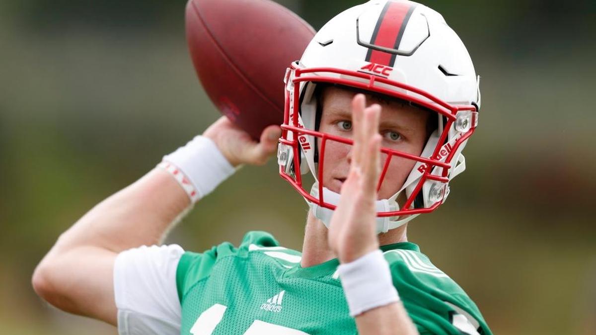 N.C. State quarterback Ryan Finley (15) prepares to pass during N.C. State football's first practice of fall camp at the Curtis and Jacqueline Dail Football Practice Complex in Raleigh on July 29, 2017.