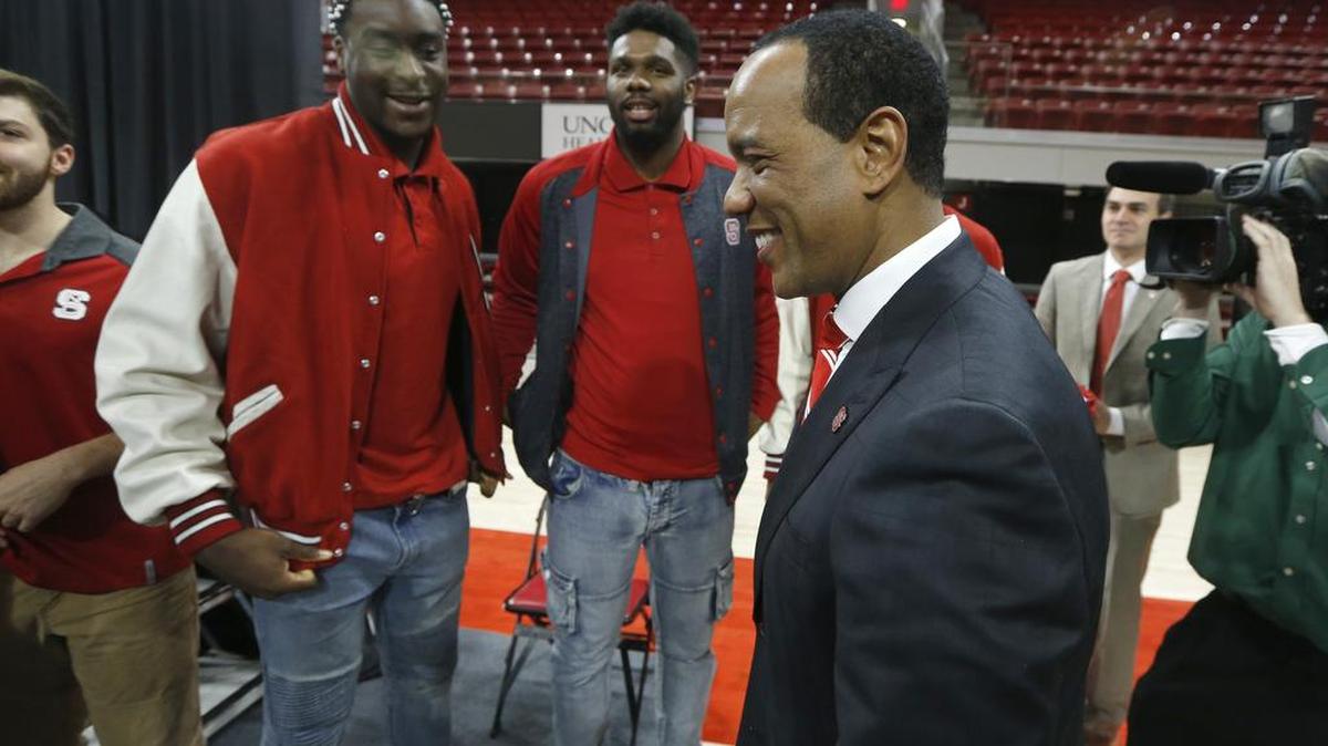 New N.C. State head men's basketball coach Kevin Keatts, right, after an introductory press conference at Reynolds Coliseum in on March 19, 2017. Players Abdul-Malik Abu, left, and Lennard Freeman, center, stand behind Keatts.