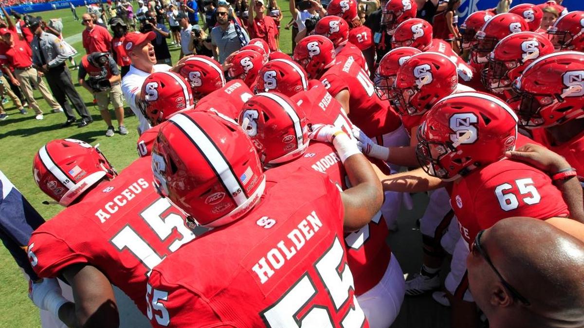 N.C. State coach Dave Doeren gets ready to lead the team out onto the field before the Wolfpack’s game against South Carolina on Sept. 2. The Wolfpack plays Marshall on Saturday.