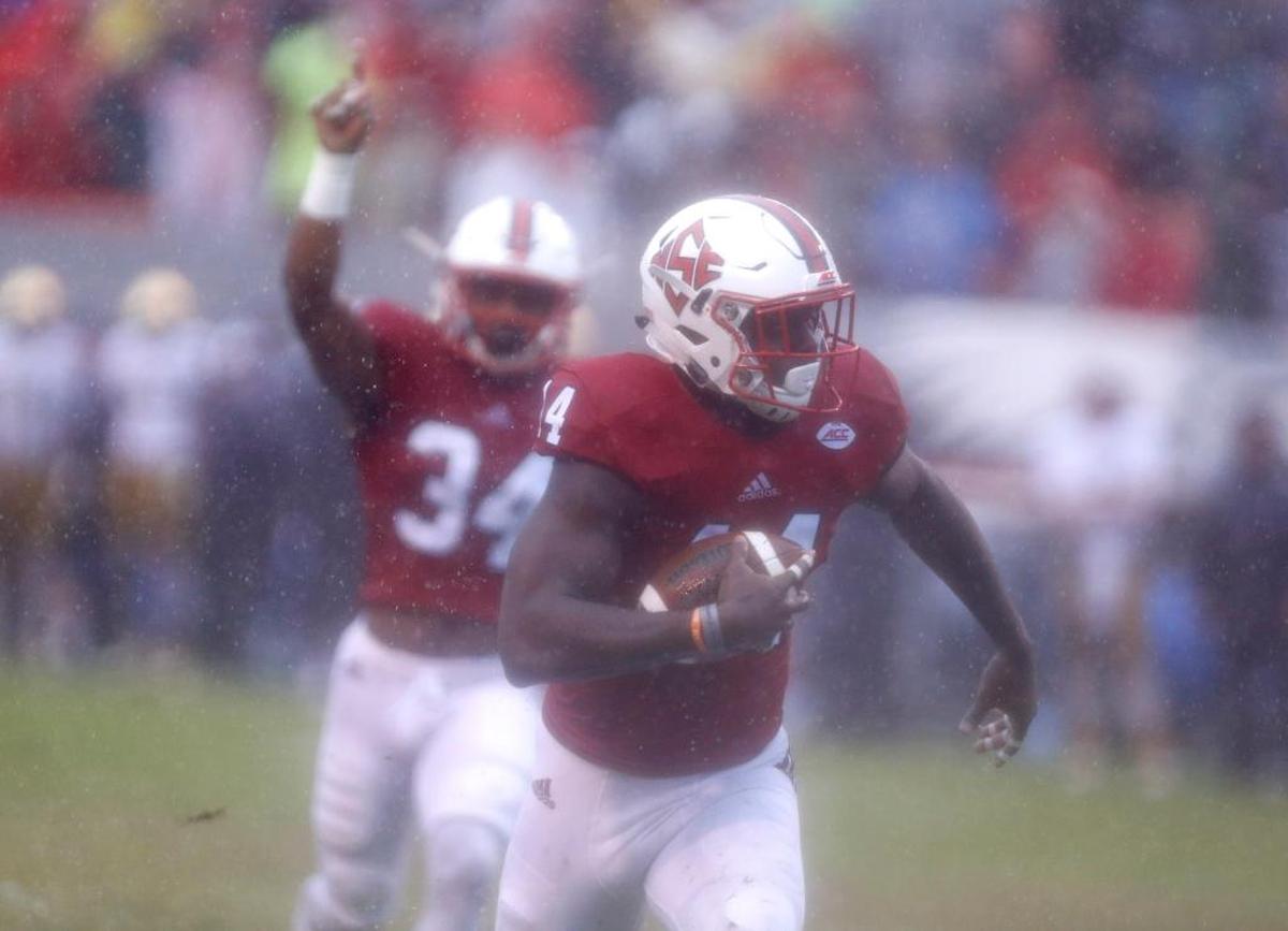 N.C. State’s Dexter Wright runs for a touchdown after a blocked Notre Dame punt in October.