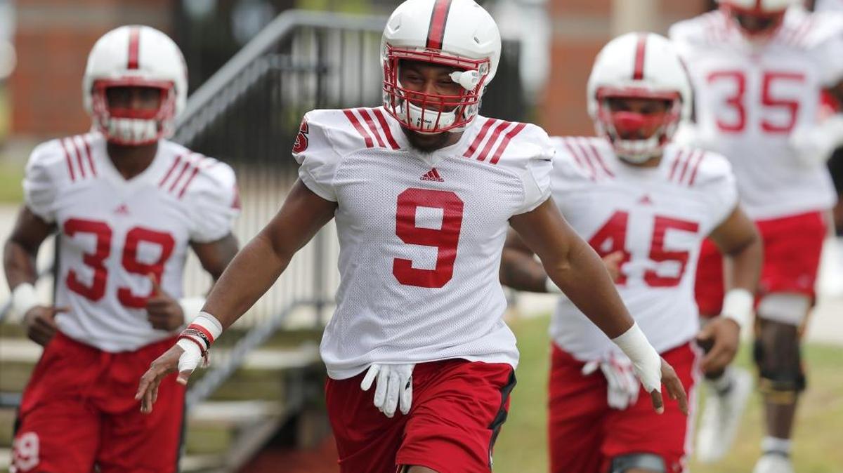 N.C. State defensive end Bradley Chubb (9) and the defense run out to the field at the start of N.C. State football's first practice of fall camp at the Curtis and Jacqueline Dail Football Practice Complex on Saturday, July 29, 2017.