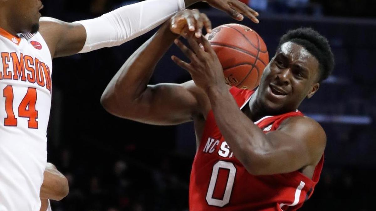 N.C. State’s Abdul-Malik Abu, right, pulls in a rebound from Clemson’s Elijah Thomas in last season’s ACC tournament.