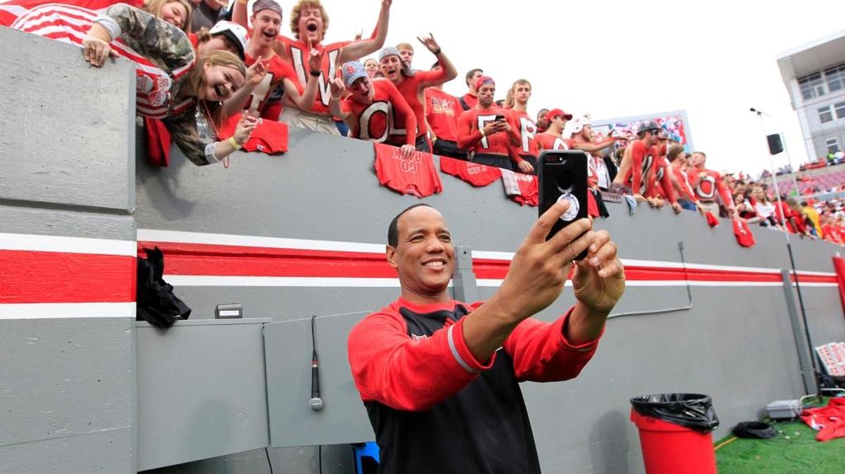 N.C. State coach Kevin Keatts takes a selfie with fans before the Wolfpack's game against Clemson at Carter-Finley Stadium on Nov. 4, 2017.