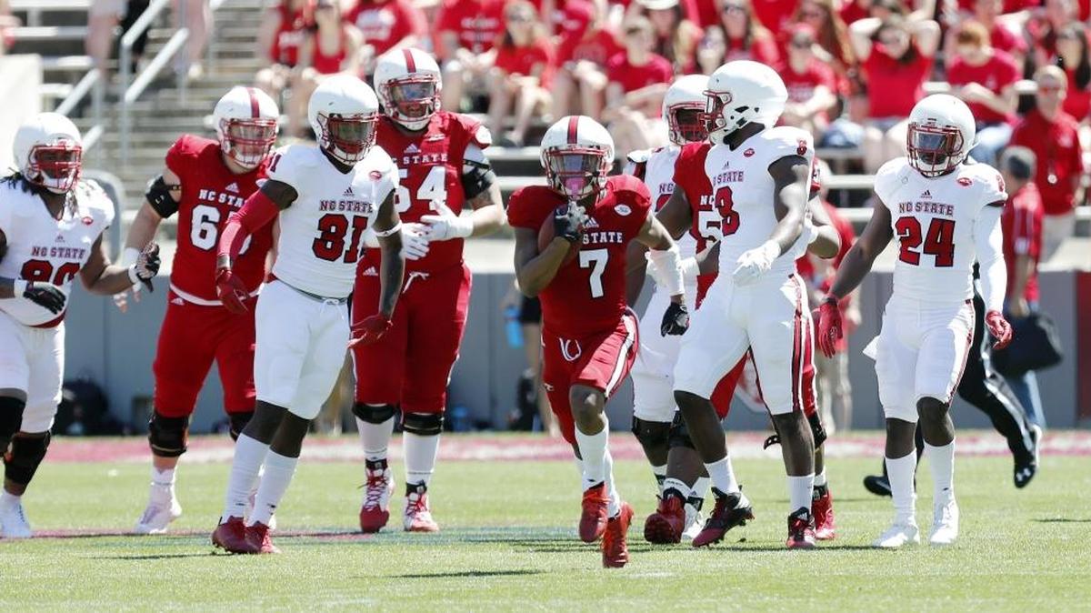 N.C. State’s Nyheim Hines (7) cuts through the defense as he runs during the spring game in April.