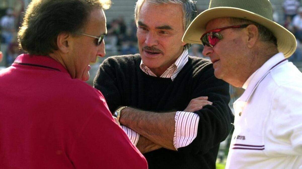 N.C. State coach Chuck Amato speaks with former FSU player Burt Reynolds, middle, and FSU coach Bobby Bowden, right, prior to the start of the NCSU-FSU game in 2001.
