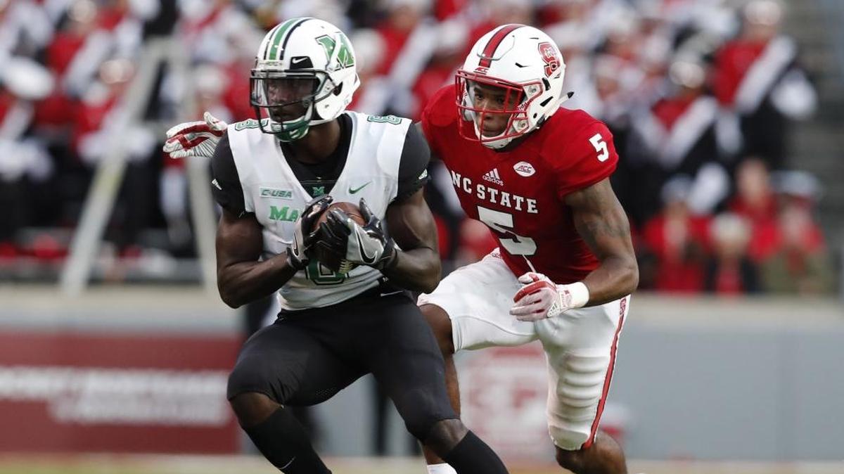 Marshall’s wide receiver Tyre Brady (8) beats N.C. State cornerback Johnathan Alston (5) for a 75-yard touchdown reception during the first half of N.C. State’s game against Marshall at Carter-Finley Stadium in Raleigh, N.C., Saturday, Sept. 9, 2017.
