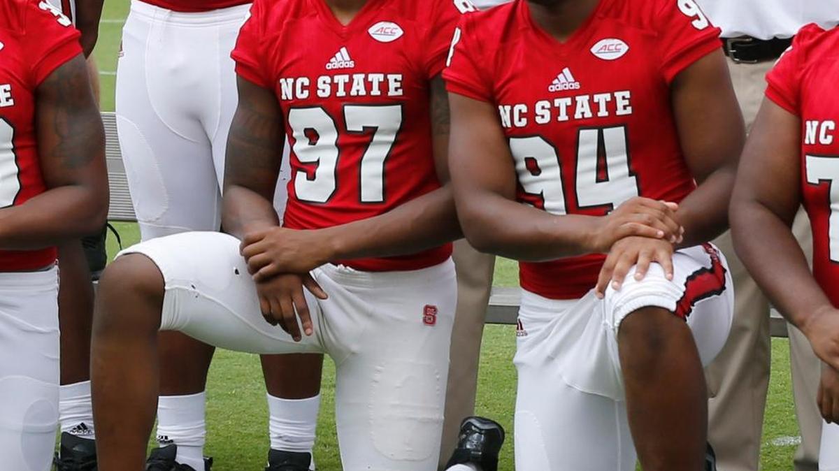 N.C. State’s Xavier Lyas, left, and Kevince Brown, right, pose during the Wolfpack’s media day on Aug. 6. Brown was dismissed from the team. Lyas was suspended from competition but remains on the team.
