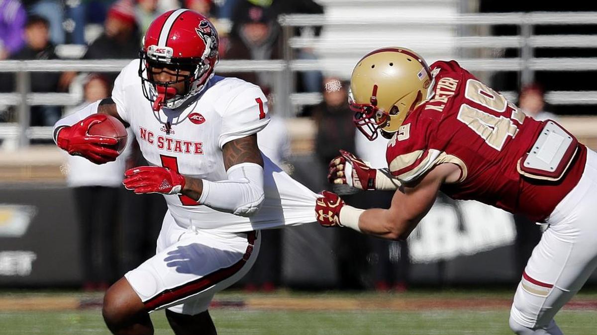 Boston College linebacker Kevin Bletzer (49) tries to stop N.C. State's Jaylen Samuels (1) during the first half of N.C. State's game against Boston College at Alumni Stadium in Chestnut Hill, MA, Saturday, Nov. 11, 2017.