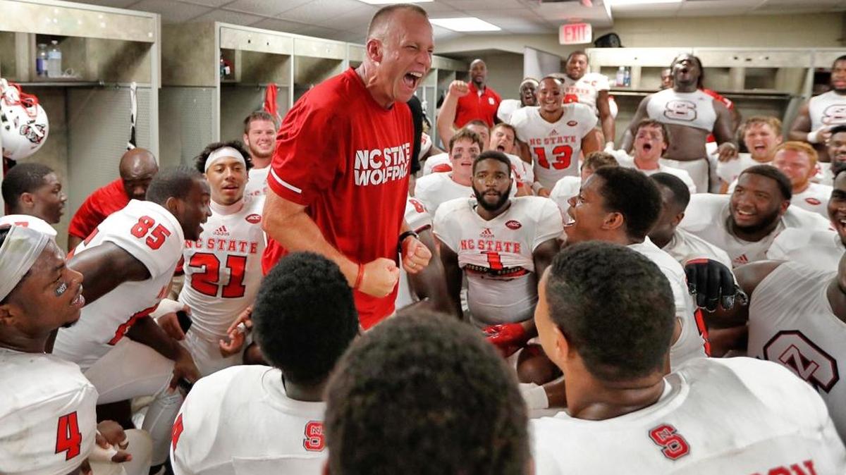 N.C. State head coach Dave Doeren celebrates in the locker room after the Wolfpack’s 27-21 victory over Florida State at Doak Campbell Stadium in Tallahasee.