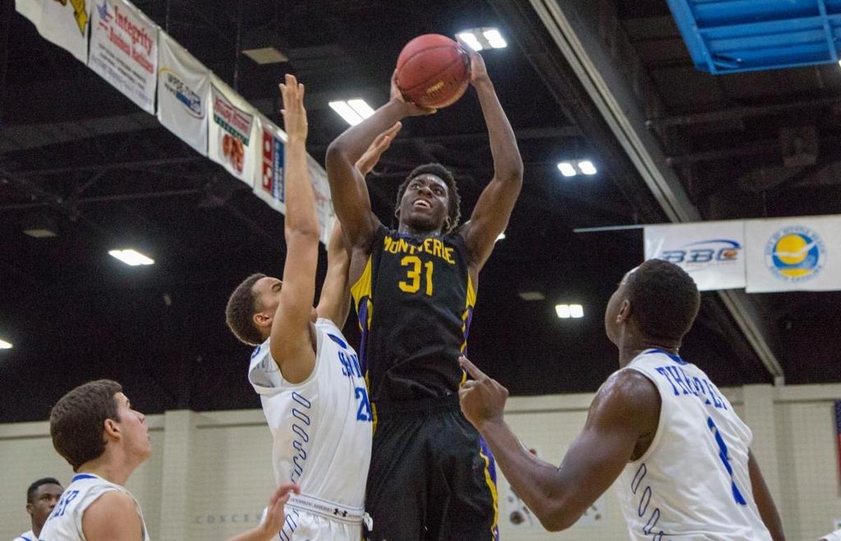 Simisola Shittu, middle, is a five-star power forward for Vermont Academy in Saxtons River, Vt. He’s the No. 7 overall recruit in the country, and ranked No. 1 at his position.