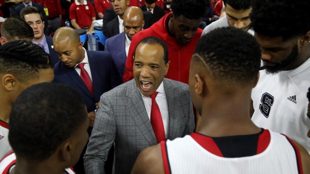 N.C. State's head coach Kevin Keatts huddles with his team prior to the first half of the season opener against VMI at PNC Arena in Raleigh, N.C., Friday, Nov. 10, 2017.
