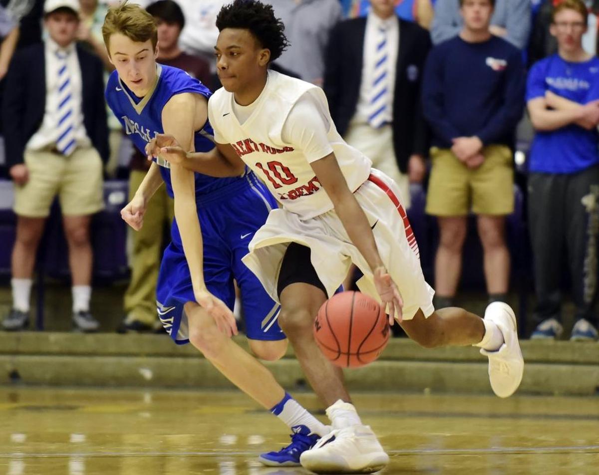 Darius Garland, right, drives past McCallie School’s Henley Edge during the Tennessee Division II AA boys’ high school basketball championship game in March.
