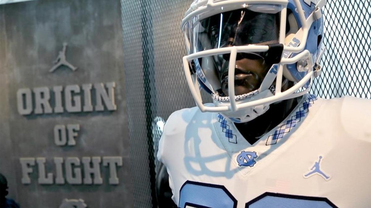 UNC football unveiled its redesigned uniforms at Meet the Heels on Saturday. The new uniforms feature the Michael Jordan Jumpman image on the jersey and an argyle pattern to the collar and helmet stripe. The promotional theme is “The Origin of Flight,” playing off Jordan and the Wright Brothers, both notable in the history of the state.
