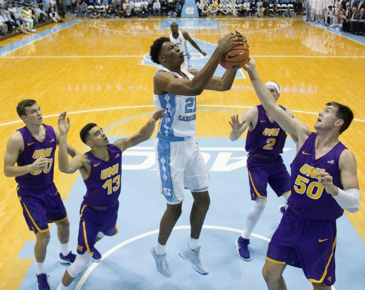 UNC’s Sterling Manley, middle, grabs an offensive rebound against Northern Iowa on Nov. 10.