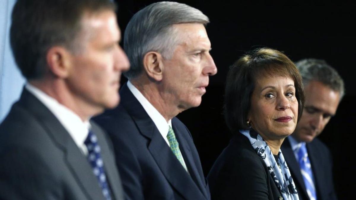 From left, Kenneth Wainstein, UNC system President Tom Ross, UNC-Chapel Hill Chancellor Carol Folt and UNC athletic director Bubba Cunningham listen as questions are asked after Wainstein presented his report from his investigation into academic fraud at UNC during a press conference on October 2014.