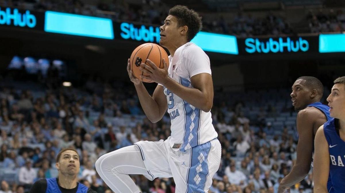 North Carolina’s Cameron Johnson, middle, breaks through the Barton College defense for two of his 11 points on Oct. 27. Johnson had surgery Wednesday to repair a torn meniscus.