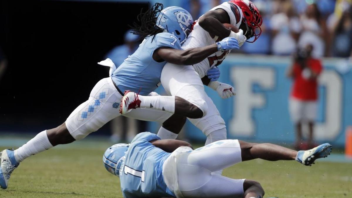 UNC’s Jonathan Smith, left, doesn’t know what to expect from Georgia Tech’s triple-option offense.