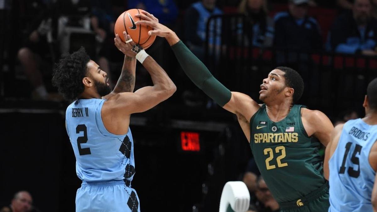 Michigan State Spartans forward Miles Bridges, middle, blocks the shot of North Carolina guard Joel Berry II during the Spartans’ 63-45 win over the Tar Heels on Sunday in the PK80 Victory Bracket championship game.