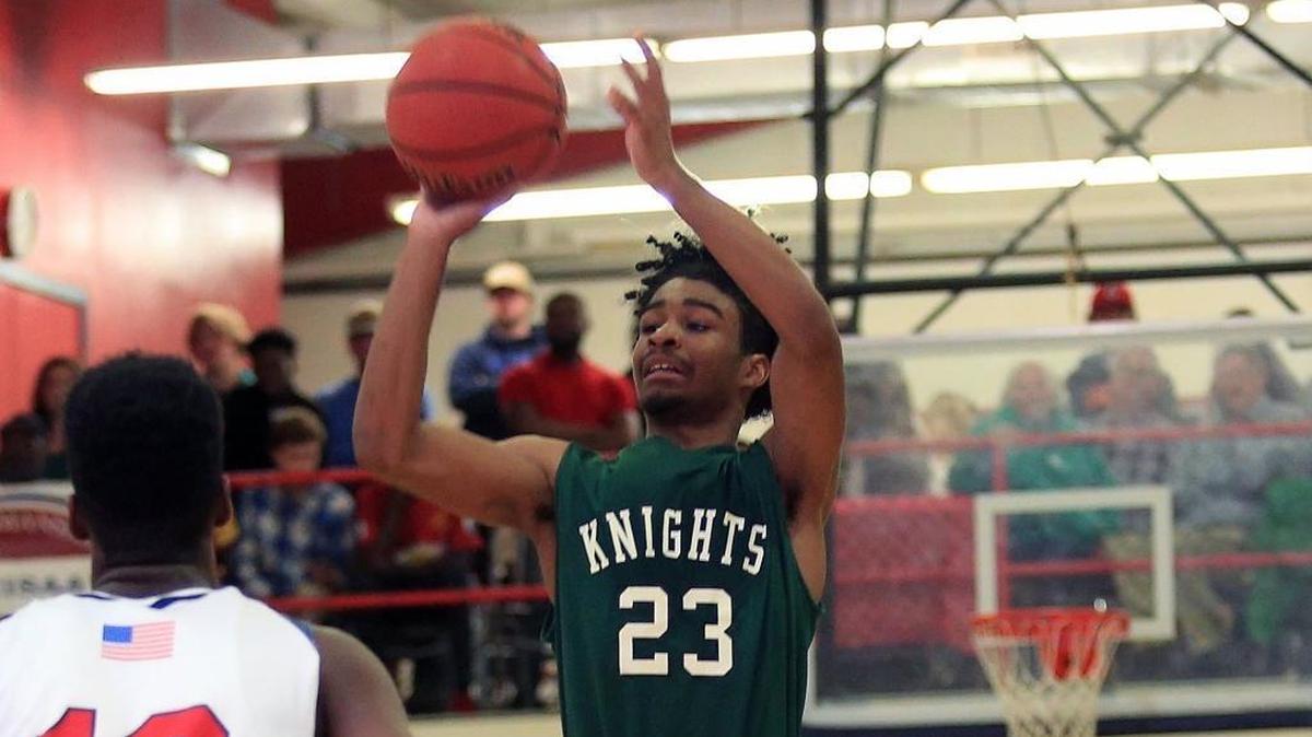 Greenfield’s Coby White, right, shoots the ball during a game against Wayne Country Day in January. White signed his National Letter of Intent with UNC earlier this month. He’ll be playing at Millbrook High School on Saturday.