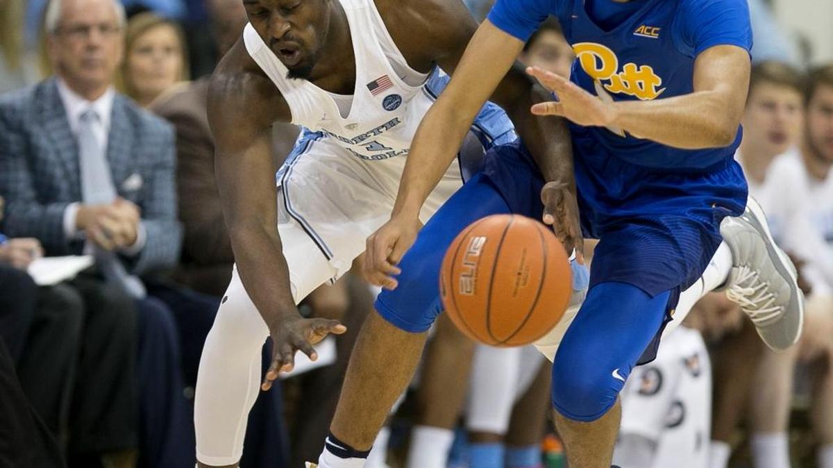 North Carolina’s Theo Pinson, left, tries to steal the ball from Pittsburgh’s Cameron Johnson in February.