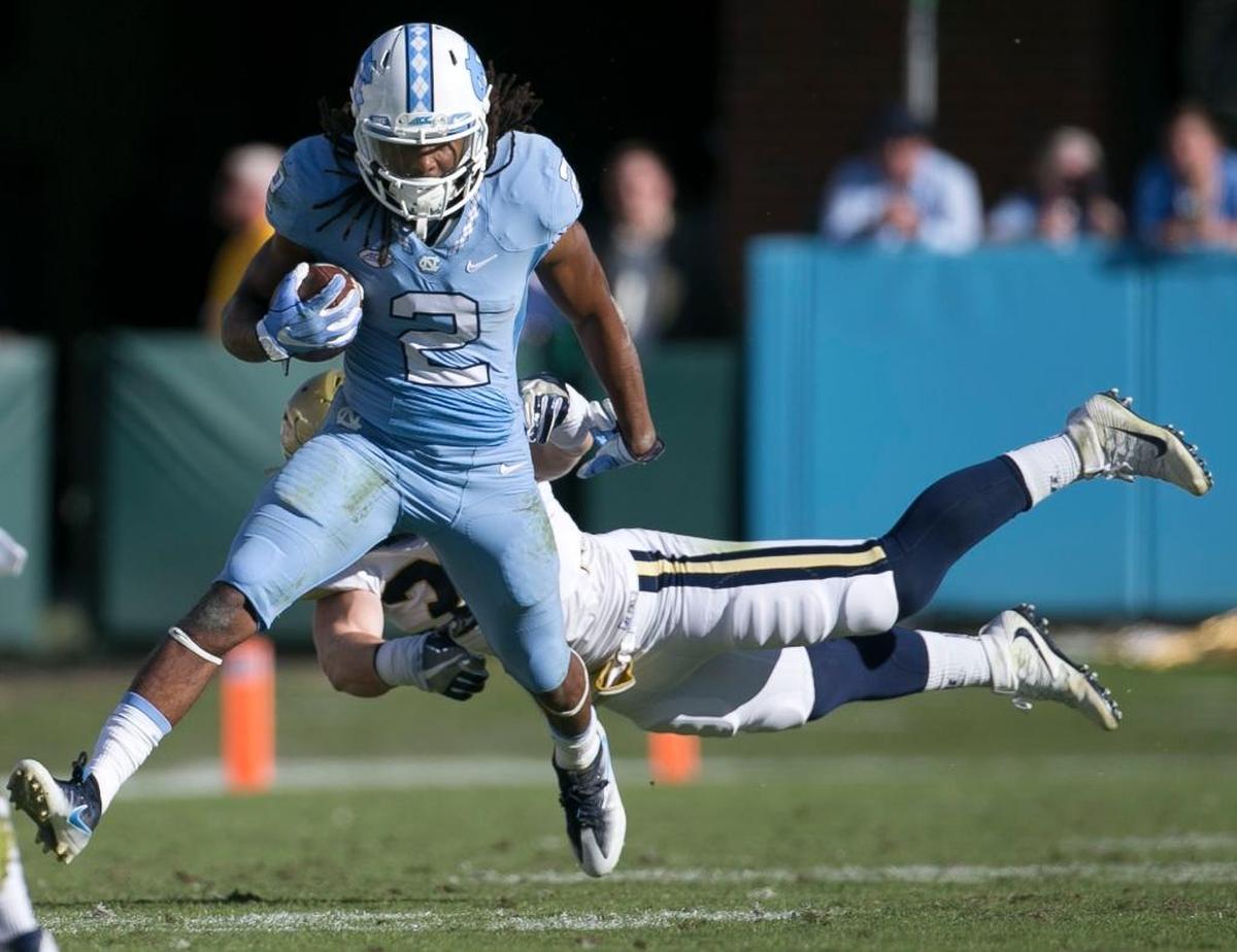 Georgia Tech’s David Curry tries to stop North Carolina running back Jordon Brown in November.