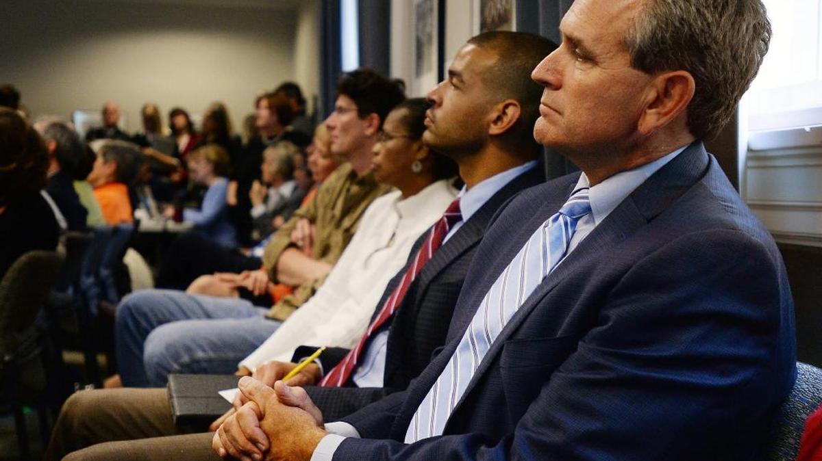 UNC Athletic Director Bubba Cunningham listens as the Faculty Council speaks to the Wainstein report on October 31, 2014.