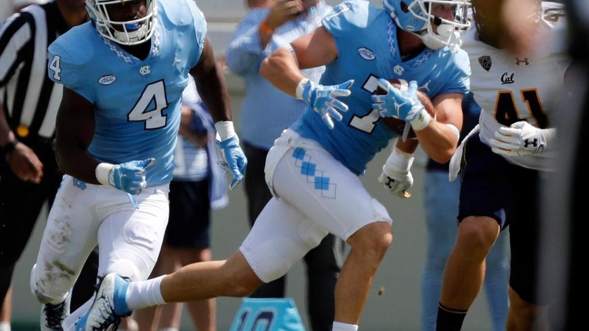 UNC's Austin Proehl, right, runs upfield against California on Saturday. Cal beat UNC, 35-30.