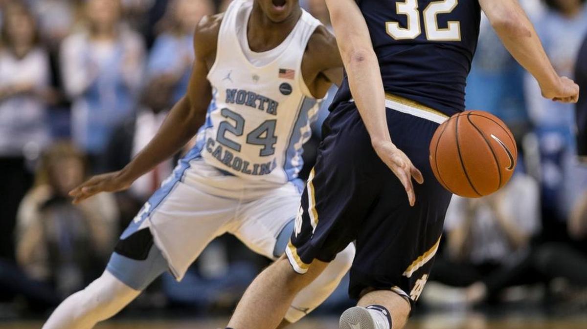UNC’s Kenny Williams, left, defends Notre Dame’s Steve Vasturia in February. Williams had knee surgery this week but is expected to participate in October.