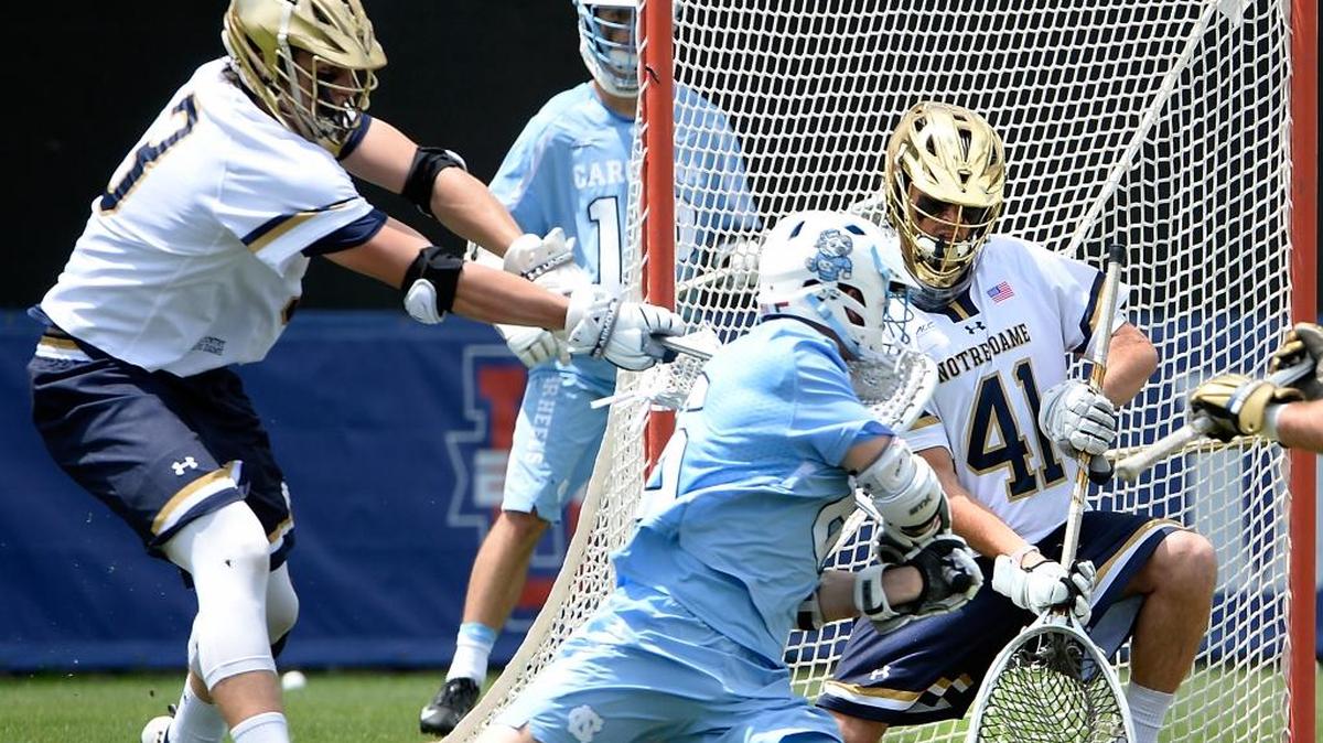 North Carolina's Justin Anderson (6) scores on Notre Dame's Shane Doss (41) during Sunday’s ACC men's lacrosse championship at Duke’s Koskinen Stadium in Durham.