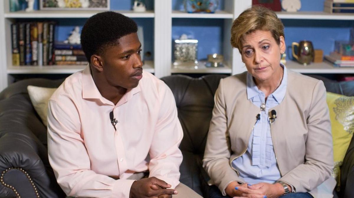 Allen Artis, a UNC football player who was accused of sexual assault, sits beside of his attorney, Kerry Sutton, during an interview in September. Prosecutors dismissed charges against Artis in June and he was reinstated to the football team on Thursday.