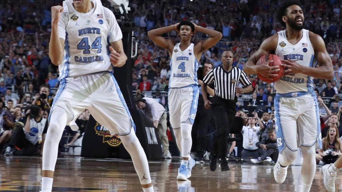 North Carolina's Justin Jackson (44), North Carolina's Isaiah Hicks (4) and North Carolina's Joel Berry II (2) celebrate with 7 seconds left during the second half of UNC's victory over Gonzaga in the NCAA Division I men's basketball national championship game at the University of Phoenix Stadium in Glendale, AZ, Monday, April 3, 2017.