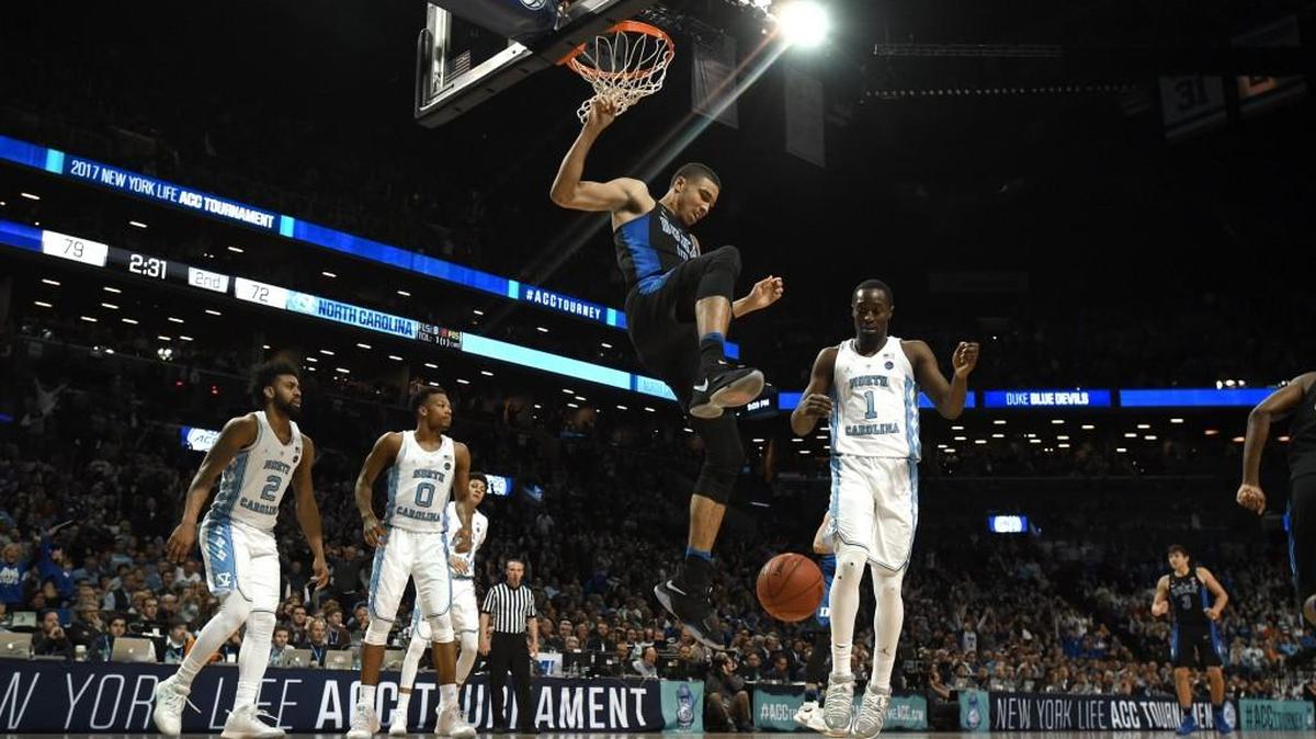 Duke forward Jayson Tatum (0) finishes a second half dunk over the Tar Heel defense. The Blue Devils defeated the Tar Heels 93-83 at the Barclays Center in Brooklyn, N.Y., on March 10, 2017