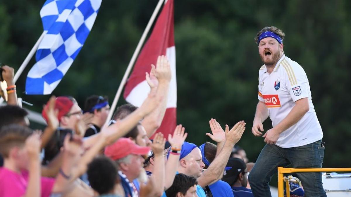 North Carolina F.C. fans encourage their team against the Houston Dynamo in June.