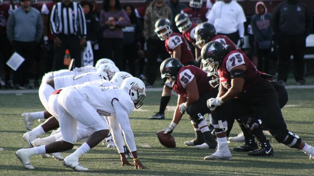 The NC Central, right, and Bethune-Cookman football teams line up on Saturday at O’Kelly-Riddick Stadium.