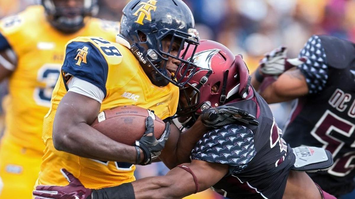 N.C. Central’s Alden McClellon, right, tackles North Carolina A&T’s Tarik Cohen in the Eagles’ 42-21 win in 2016.