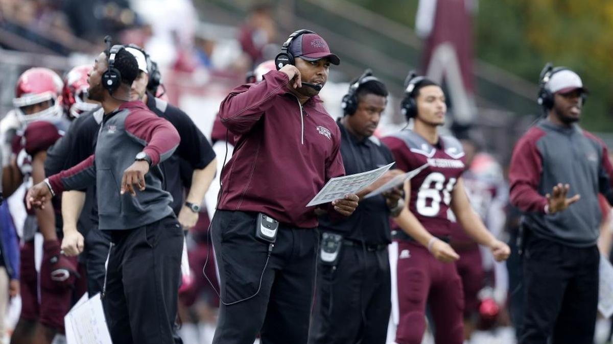 NCCU's head coach Jerry Mack, center, watches his team play during a 2015 game at O'Kelly-Riddick Stadium.