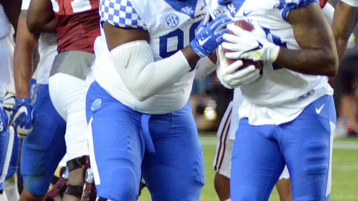 Kentucky's Tymere Dubose celebrates the fumble recovery by De'Niro Laster (left) at Alabama last season. Laster will play for N.C. Central this season.