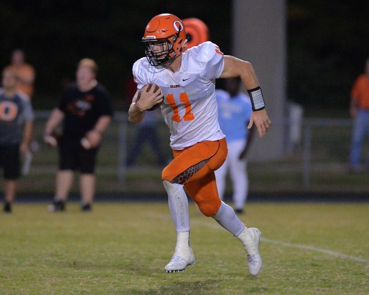 Orange's Payton Wilson (12) runs the ball for yardage during the second quarter. The Riverside Pirates took on the Orange Panthers in a non-conference home football game in Durham, N.C. on September 15, 2017. Orange wins 23-3.