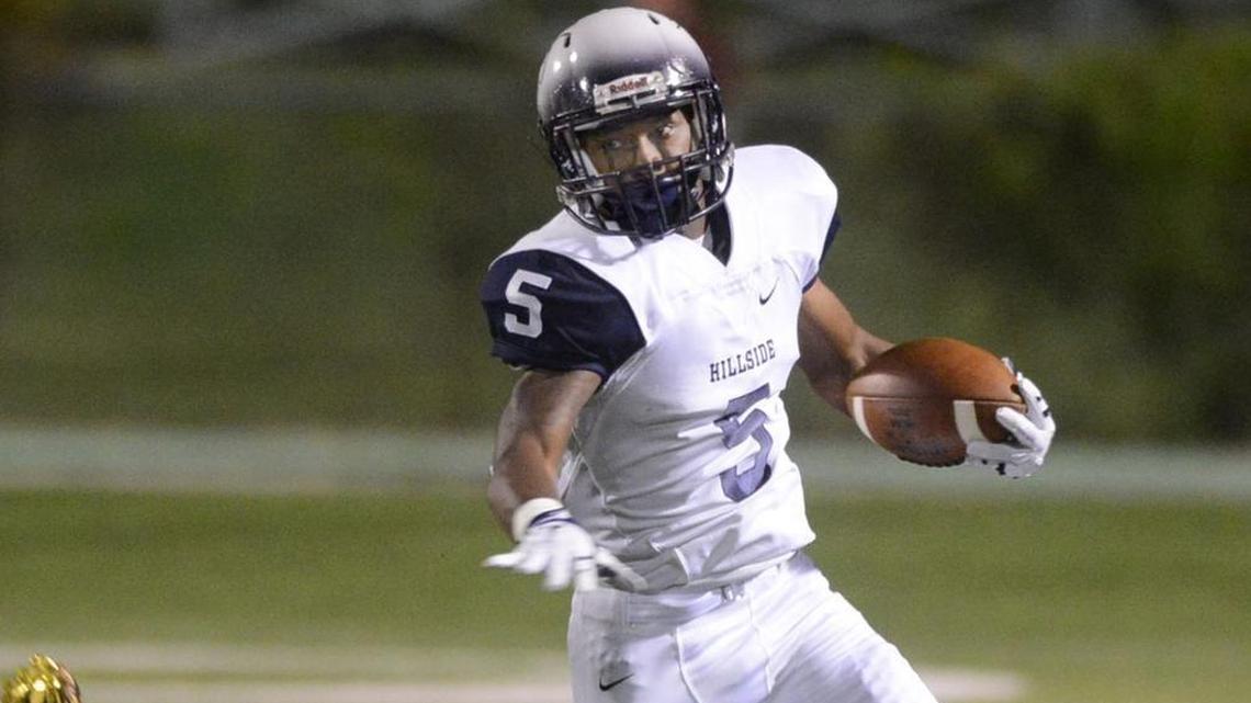 Jamal Currie-Elliott (5) runs for extra yards during his senior season at Hillside High School in Durham. Currie-Elliott left Oregon in the spring and will play for North Carolina Central this season.