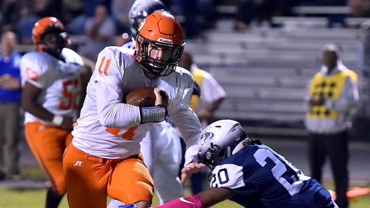 Orange's Payton Wilson (11) runs the ball in for the touchdown while defended by Hillside's Chris Rogers (20). The Orange Panthers visited the Hillside Hornets in a high school football game on Oct. 13, 2017. Orange wins 31-20.