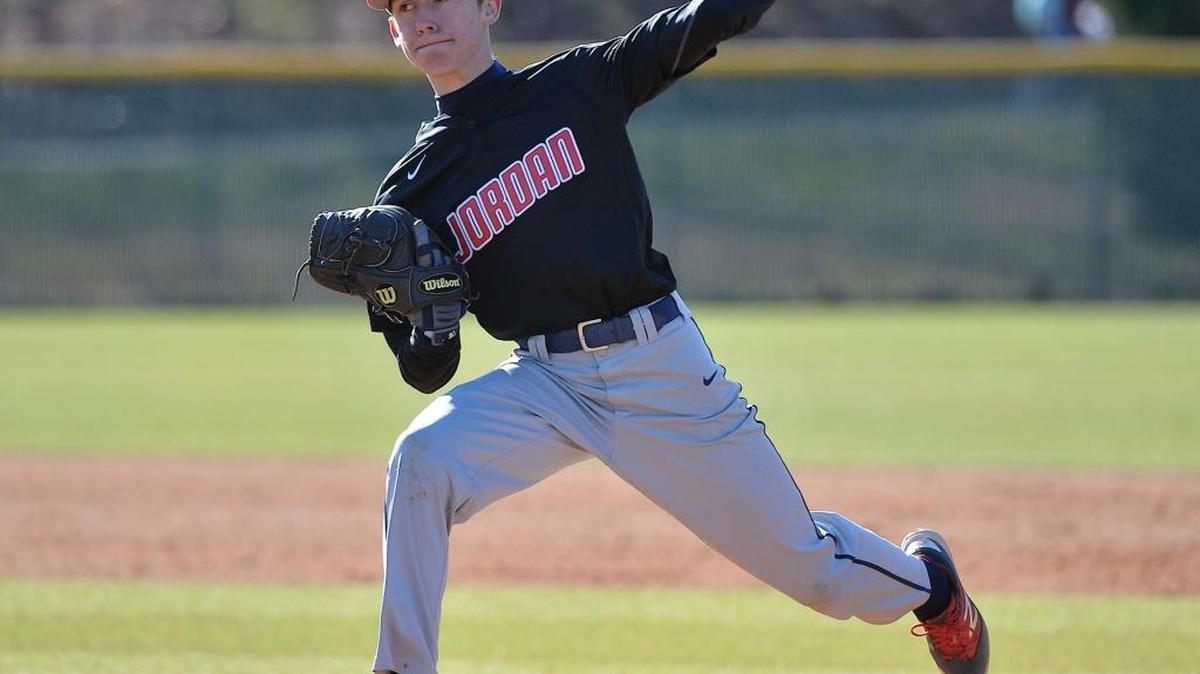 Jordan's Connor Garcia (5) winds up for the pitch. The Jordan Falcons took on the East Chapel Hill Wildcats in baseball in Chapel Hill, N.C. on March 15, 2017. Jordan wins 6-1.