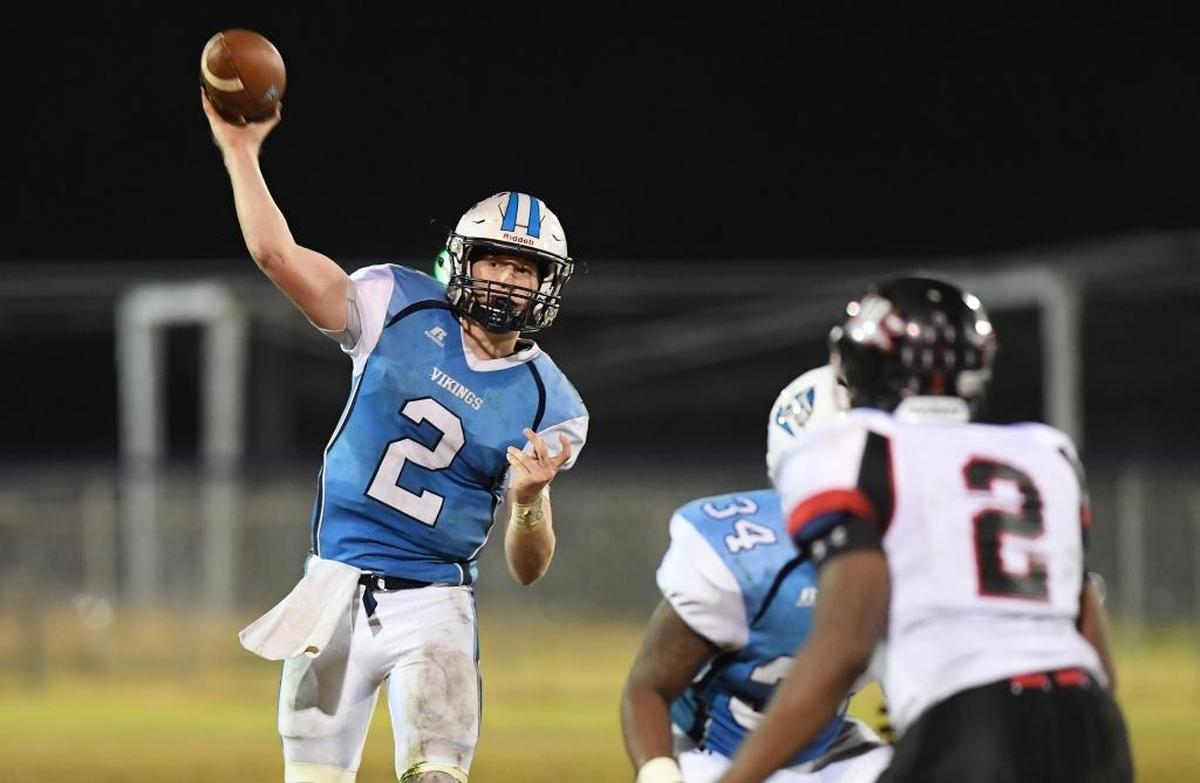 Tucker Brown, left, of South Granville throws a pass against Jaquan Brandon, right, of J.F. Webb. The J.F. Webb Warriors visited the South Granville Vikings in a high school football game on Nov. 3, 2017.