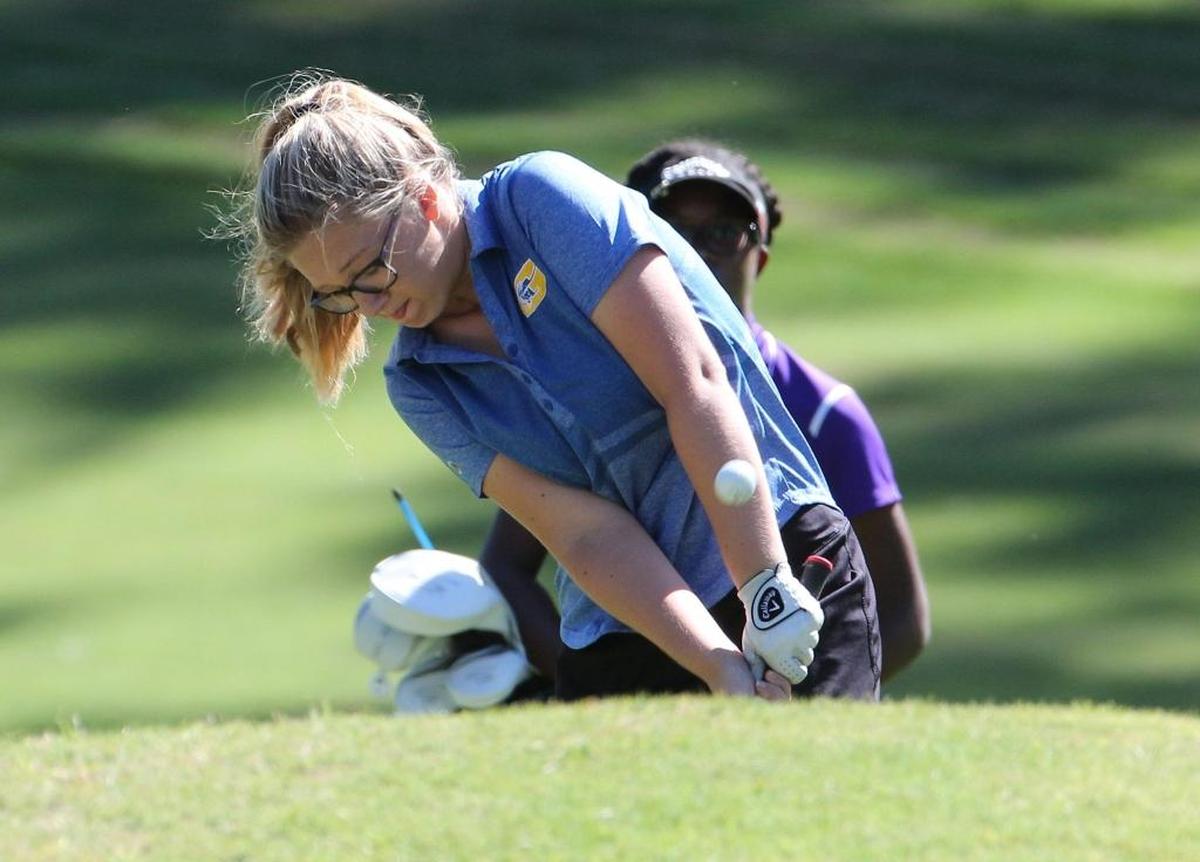 Kayla Ward of Garner blast out of a sand trap. The NCHSAA 4A girls golf state championship was held Oct. 23-24 at the Pinehurst golf club.