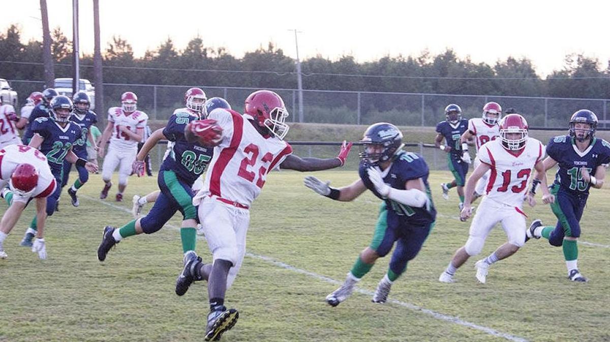 Northeast-Hobgood Academy senior running back Tay Mosley, left, stiff arms Halifax Academy defender Harrison Hardee during the first meeting this season between the two rivals on Sept. 17, when the Vikings defeated Northeast-Hobgood Academy 36-26. Mosley and Northeast-Hobgood went on to beat Halifax, 25-24, in the NCISAA 1A state championship game on Nov. 11.